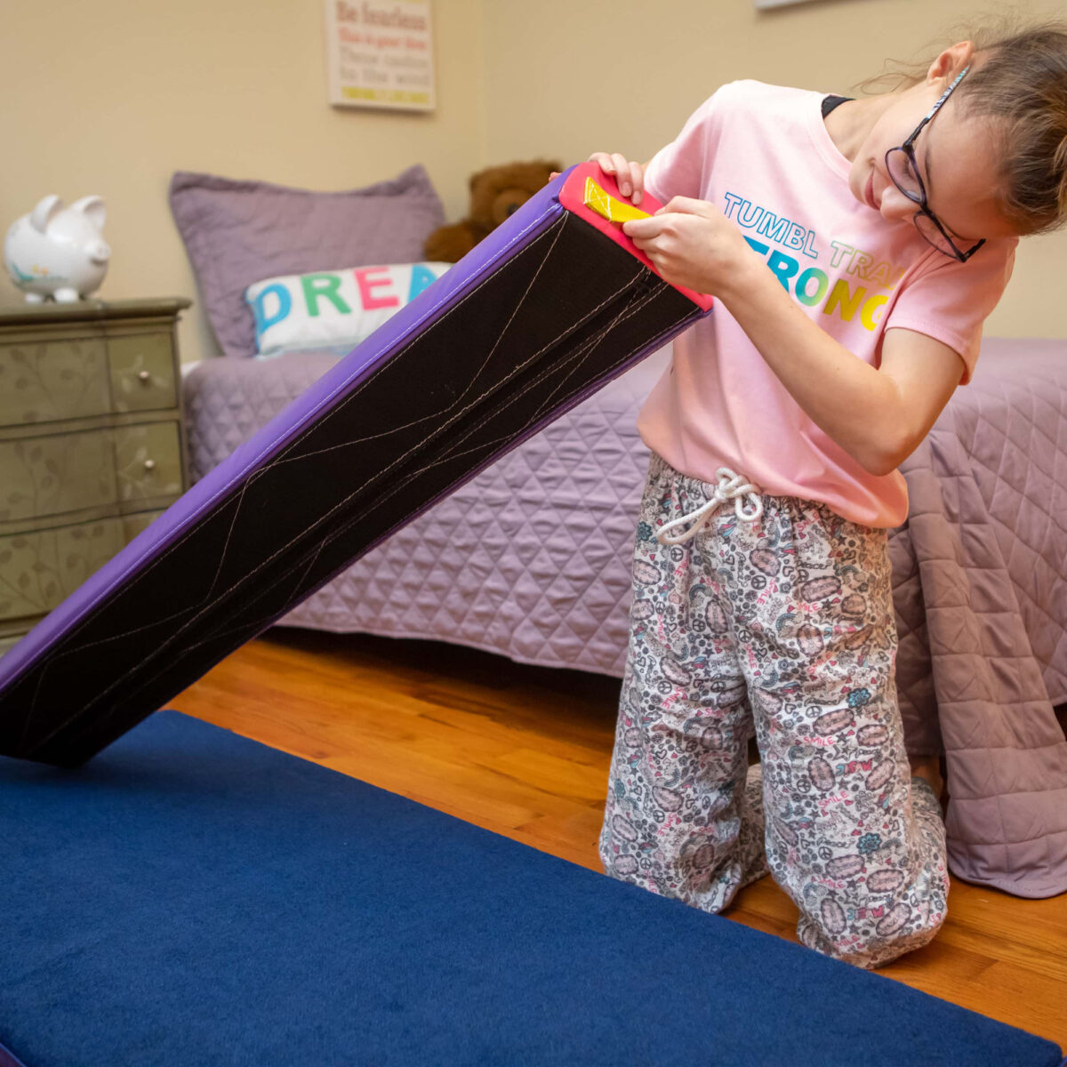 A girl looking at the Velcro back of the Half Round