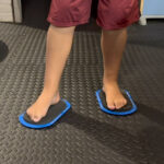A photo showing a child's feet on the small Sliders.