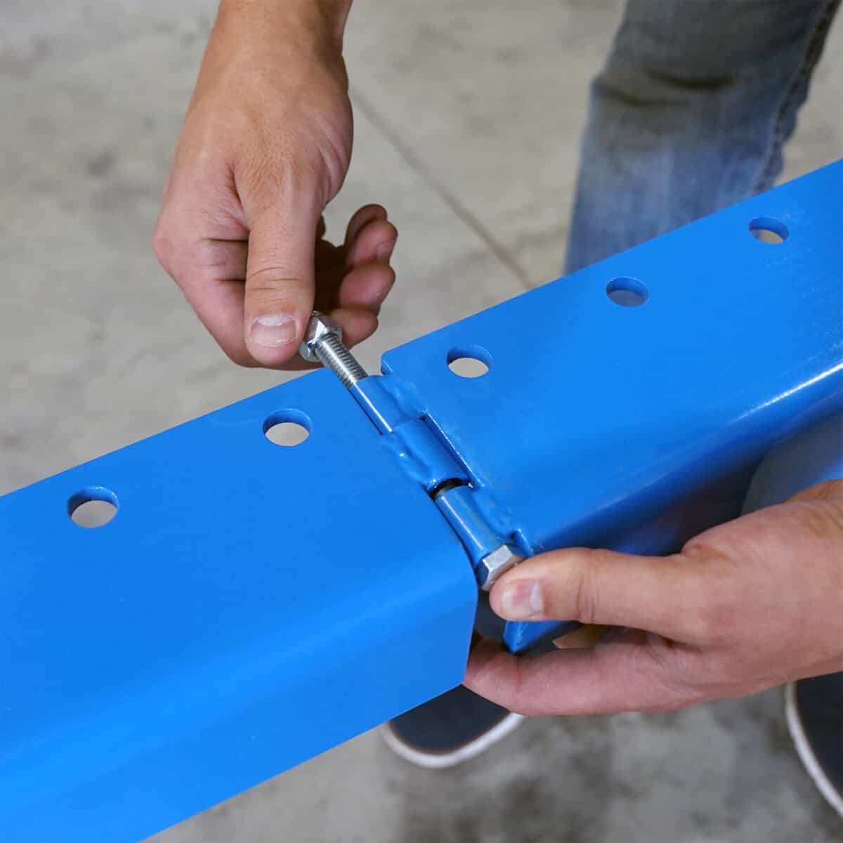A photo showing a close-up of the Tumbl Trak rails being assembled.